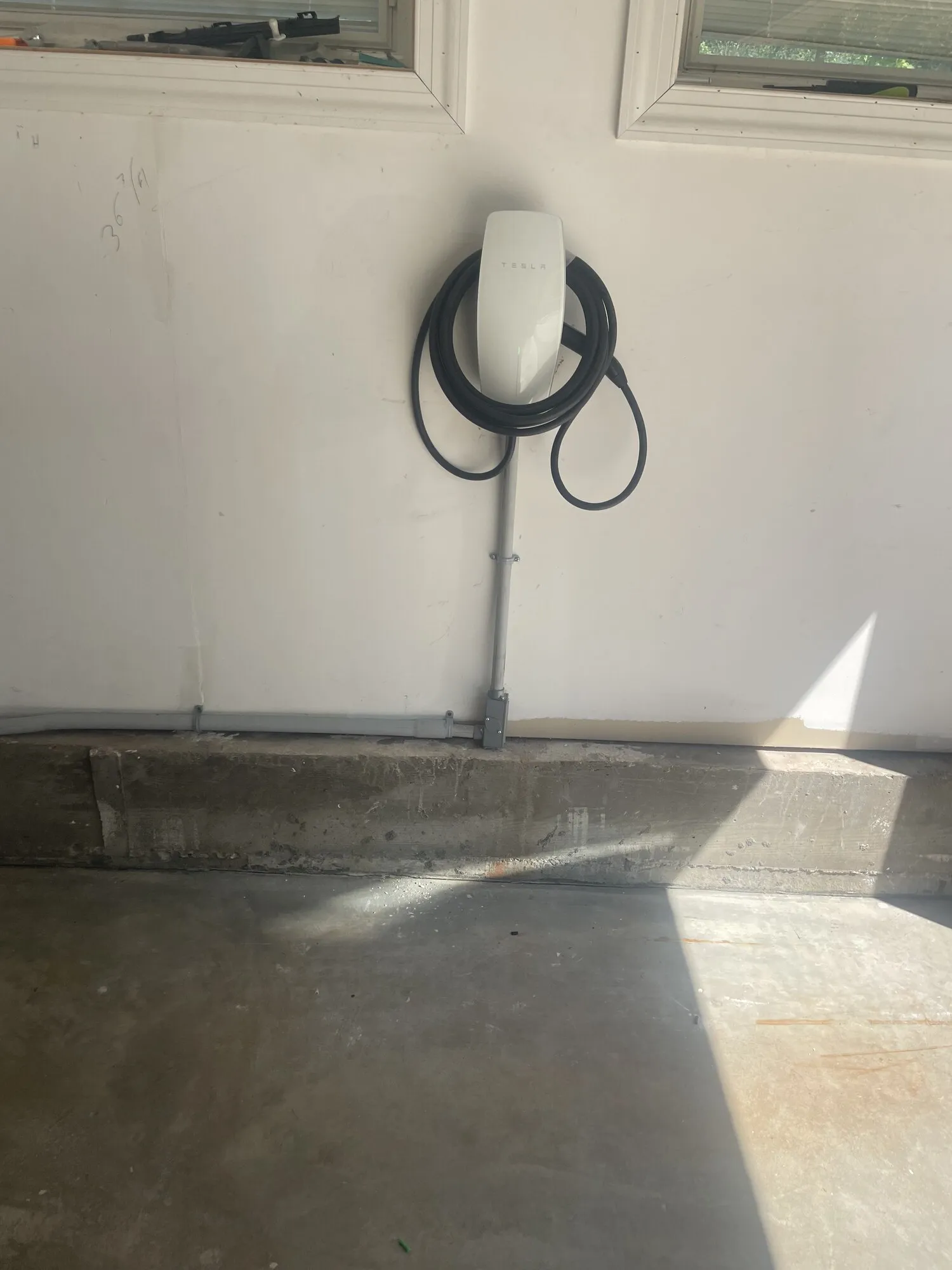 Tesla Wall Connector EV charger installed by DTM Electric in a Brick, NJ garage